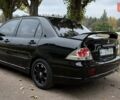 Чорний Міцубісі Lancer, об'ємом двигуна 1.58 л та пробігом 386 тис. км за 4450 $, фото 3 на Automoto.ua