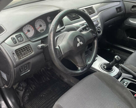 Чорний Міцубісі Lancer, об'ємом двигуна 1.58 л та пробігом 237 тис. км за 3500 $, фото 6 на Automoto.ua