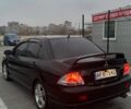 Черный Мицубиси Лансер, объемом двигателя 2 л и пробегом 238 тыс. км за 6000 $, фото 5 на Automoto.ua