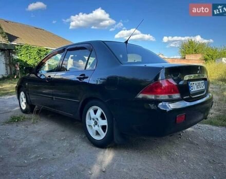 Мицубиси Лансер 2006 в Киеве на Automoto.ua Черный Мицубиси Лансер, объемом двигателя 1.58 л и пробегом 268 тыс. км за 3400 $, фото 3 на Automoto.ua