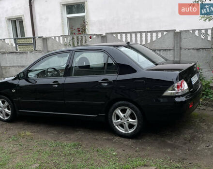 Мицубиси Лансер 2006 в Днепре (Днепропетровске) на Automoto.ua Черный Мицубиси Лансер, объемом двигателя 1.58 л и пробегом 166 тыс. км за 4800 $, фото 3 на Automoto.ua