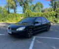 Чорний Міцубісі Lancer, об'ємом двигуна 1.58 л та пробігом 205 тис. км за 4700 $, фото 1 на Automoto.ua