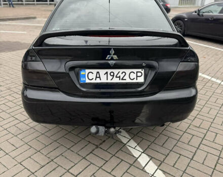 Черный Мицубиси Лансер, объемом двигателя 1.58 л и пробегом 370 тыс. км за 3500 $, фото 4 на Automoto.ua