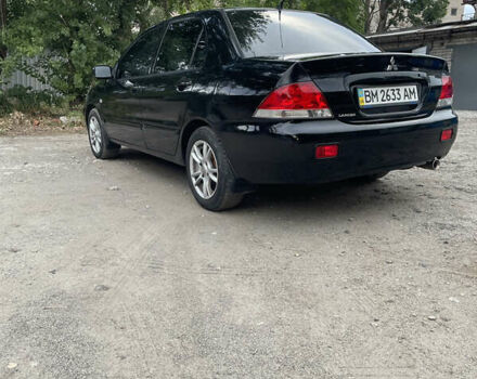 Чорний Міцубісі Lancer, об'ємом двигуна 1.6 л та пробігом 240 тис. км за 4599 $, фото 3 на Automoto.ua