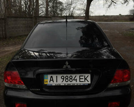 Чорний Міцубісі Lancer, об'ємом двигуна 1.58 л та пробігом 210 тис. км за 3900 $, фото 1 на Automoto.ua