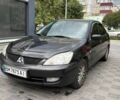 Чорний Міцубісі Lancer, об'ємом двигуна 1.58 л та пробігом 266 тис. км за 4400 $, фото 1 на Automoto.ua