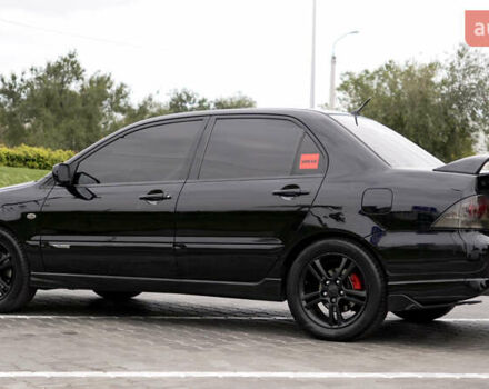 Черный Мицубиси Лансер, объемом двигателя 2 л и пробегом 253 тыс. км за 6900 $, фото 1 на Automoto.ua