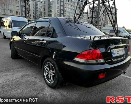 Чорний Міцубісі Lancer, об'ємом двигуна 1.6 л та пробігом 329 тис. км за 3500 $, фото 3 на Automoto.ua