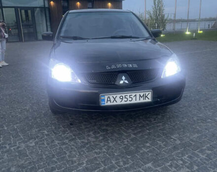 Черный Мицубиси Лансер, объемом двигателя 1.6 л и пробегом 231 тыс. км за 4250 $, фото 1 на Automoto.ua