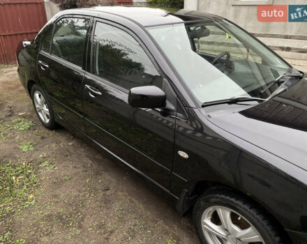 Мицубиси Лансер 2006 в Днепре (Днепропетровске) на Automoto.ua Черный Мицубиси Лансер, объемом двигателя 1.58 л и пробегом 166 тыс. км за 4800 $, фото 2 на Automoto.ua
