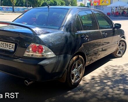 Черный Мицубиси Лансер, объемом двигателя 1.6 л и пробегом 238 тыс. км за 4300 $, фото 1 на Automoto.ua