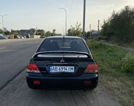 Черный Мицубиси Лансер, объемом двигателя 1.6 л и пробегом 260 тыс. км за 3800 $, фото 5 на Automoto.ua