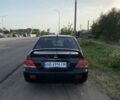 Черный Мицубиси Лансер, объемом двигателя 1.6 л и пробегом 260 тыс. км за 3800 $, фото 5 на Automoto.ua