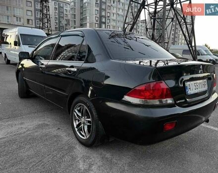 Чорний Міцубісі Lancer, об'ємом двигуна 1.58 л та пробігом 329 тис. км за 3500 $, фото 4 на Automoto.ua