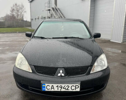 Черный Мицубиси Лансер, объемом двигателя 1.6 л и пробегом 368 тыс. км за 3200 $, фото 1 на Automoto.ua