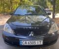 Чорний Міцубісі Lancer, об'ємом двигуна 1.6 л та пробігом 273 тис. км за 6000 $, фото 1 на Automoto.ua
