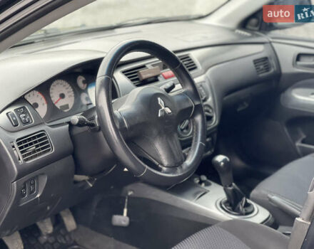 Чорний Міцубісі Lancer, об'ємом двигуна 1.58 л та пробігом 230 тис. км за 3350 $, фото 15 на Automoto.ua