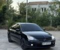 Черный Мицубиси Лансер, объемом двигателя 2 л и пробегом 170 тыс. км за 5500 $, фото 1 на Automoto.ua