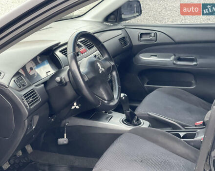 Чорний Міцубісі Lancer, об'ємом двигуна 1.58 л та пробігом 230 тис. км за 3350 $, фото 16 на Automoto.ua