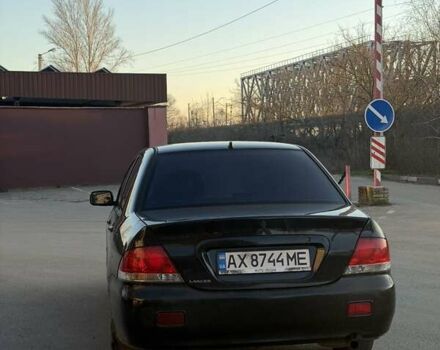 Черный Мицубиси Лансер, объемом двигателя 1.58 л и пробегом 247 тыс. км за 3300 $, фото 3 на Automoto.ua