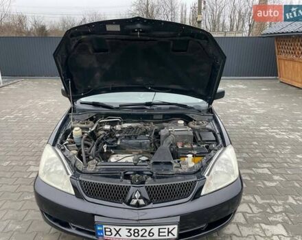 Чорний Міцубісі Lancer, об'ємом двигуна 1.58 л та пробігом 282 тис. км за 4100 $, фото 4 на Automoto.ua