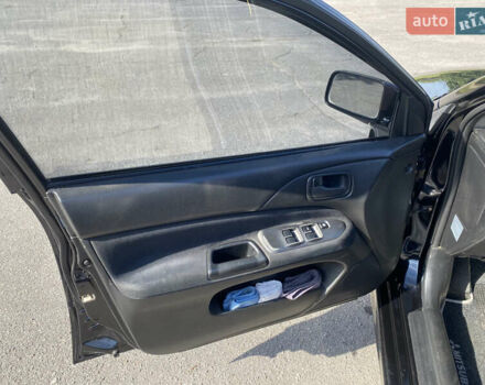 Чорний Міцубісі Lancer, об'ємом двигуна 1.58 л та пробігом 236 тис. км за 4500 $, фото 6 на Automoto.ua