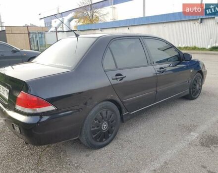 Чорний Міцубісі Lancer, об'ємом двигуна 1.58 л та пробігом 290 тис. км за 3200 $, фото 10 на Automoto.ua