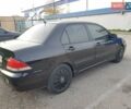 Чорний Міцубісі Lancer, об'ємом двигуна 1.58 л та пробігом 290 тис. км за 3200 $, фото 10 на Automoto.ua