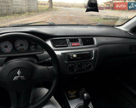 Чорний Міцубісі Lancer, об'ємом двигуна 1.58 л та пробігом 210 тис. км за 3900 $, фото 19 на Automoto.ua