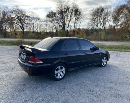 Черный Мицубиси Лансер, объемом двигателя 1.6 л и пробегом 200 тыс. км за 3400 $, фото 2 на Automoto.ua