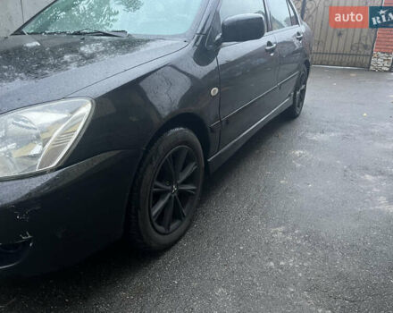 Черный Мицубиси Лансер, объемом двигателя 1.58 л и пробегом 250 тыс. км за 2450 $, фото 1 на Automoto.ua