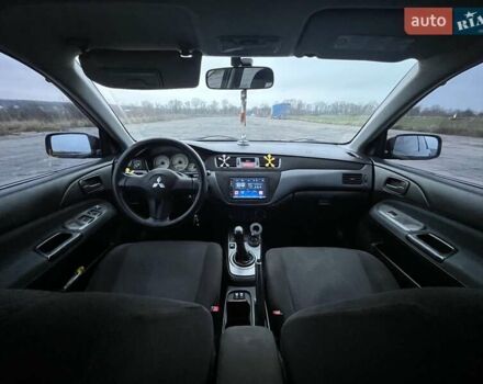 Чорний Міцубісі Lancer, об'ємом двигуна 1.58 л та пробігом 282 тис. км за 4100 $, фото 10 на Automoto.ua