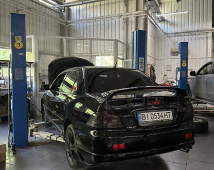 Черный Мицубиси Лансер, объемом двигателя 2 л и пробегом 253 тыс. км за 6900 $, фото 22 на Automoto.ua