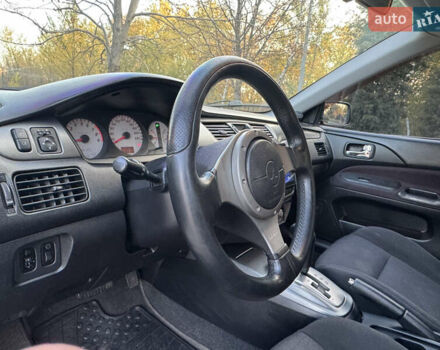 Міцубісі Lancer 2006 у Дніпро (Дніпропетровську) на Automoto.ua Чорний Міцубісі Lancer, об'ємом двигуна 2 л та пробігом 230 тис. км за 4900 $, фото 16 на Automoto.ua