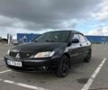 Чорний Міцубісі Lancer, об'ємом двигуна 1.58 л та пробігом 240 тис. км за 4099 $, фото 1 на Automoto.ua