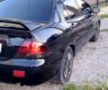 Чорний Міцубісі Lancer, об'ємом двигуна 1.6 л та пробігом 276 тис. км за 4150 $, фото 1 на Automoto.ua