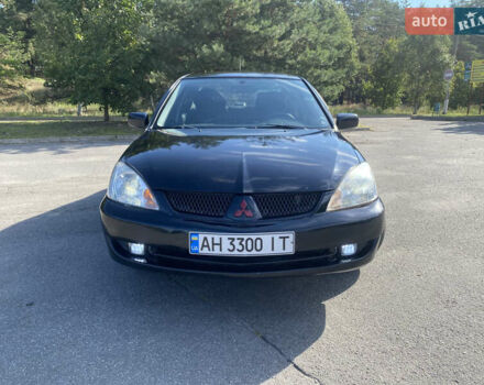 Чорний Міцубісі Lancer, об'ємом двигуна 1.58 л та пробігом 236 тис. км за 4500 $, фото 1 на Automoto.ua