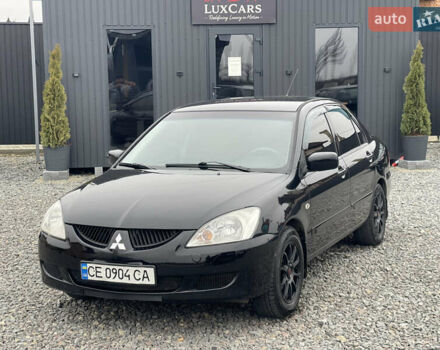 Чорний Міцубісі Lancer, об'ємом двигуна 1.58 л та пробігом 230 тис. км за 3350 $, фото 14 на Automoto.ua