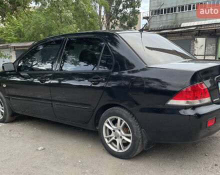 Чорний Міцубісі Lancer, об'ємом двигуна 1.6 л та пробігом 240 тис. км за 4599 $, фото 7 на Automoto.ua