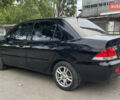 Чорний Міцубісі Lancer, об'ємом двигуна 1.6 л та пробігом 240 тис. км за 4599 $, фото 7 на Automoto.ua