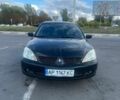 Чорний Міцубісі Lancer, об'ємом двигуна 1.58 л та пробігом 245 тис. км за 3300 $, фото 1 на Automoto.ua