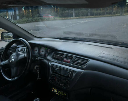 Черный Мицубиси Лансер, объемом двигателя 1.6 л и пробегом 233 тыс. км за 3650 $, фото 11 на Automoto.ua