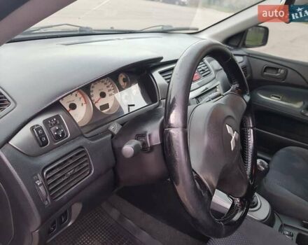 Чорний Міцубісі Lancer, об'ємом двигуна 1.58 л та пробігом 290 тис. км за 3200 $, фото 16 на Automoto.ua
