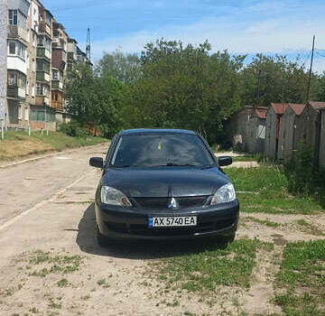Чорний Міцубісі Lancer, об'ємом двигуна 1.58 л та пробігом 277 тис. км за 3900 $, фото 3 на Automoto.ua
