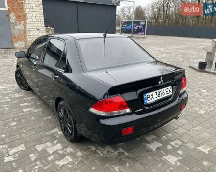 Чорний Міцубісі Lancer, об'ємом двигуна 1.58 л та пробігом 282 тис. км за 4100 $, фото 3 на Automoto.ua