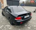Чорний Міцубісі Lancer, об'ємом двигуна 1.58 л та пробігом 282 тис. км за 4100 $, фото 3 на Automoto.ua