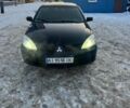 Черный Мицубиси Лансер, объемом двигателя 1.6 л и пробегом 253 тыс. км за 3500 $, фото 1 на Automoto.ua