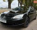 Чорний Міцубісі Lancer, об'ємом двигуна 1.58 л та пробігом 386 тис. км за 4450 $, фото 1 на Automoto.ua