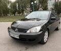 Черный Мицубиси Лансер, объемом двигателя 1.58 л и пробегом 250 тыс. км за 2700 $, фото 1 на Automoto.ua