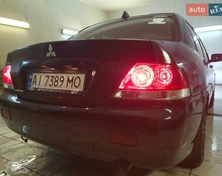 Чорний Міцубісі Lancer, об'ємом двигуна 1.58 л та пробігом 222 тис. км за 2999 $, фото 2 на Automoto.ua